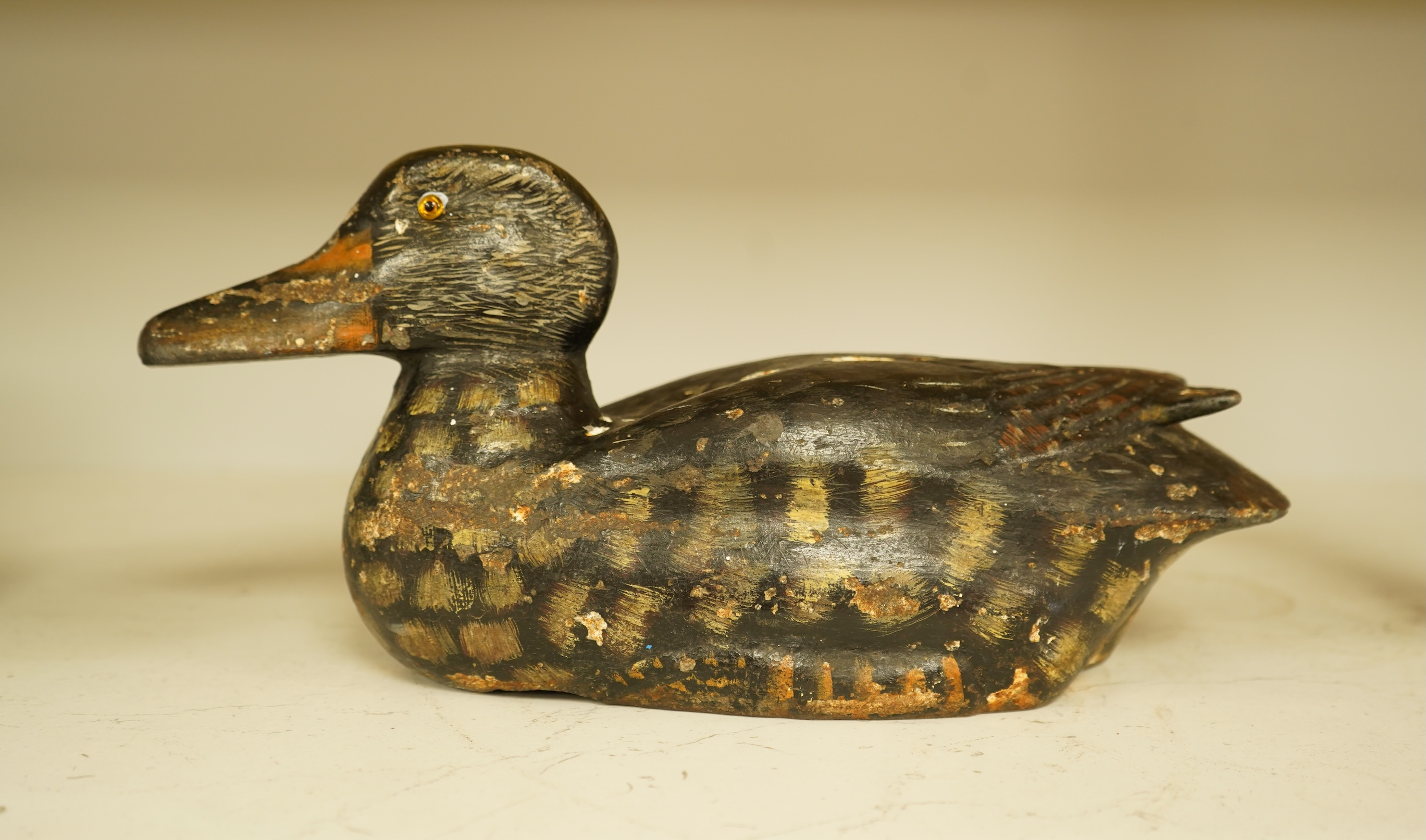 A novelty cast iron doorstop in the form of a duck, 32cm wide